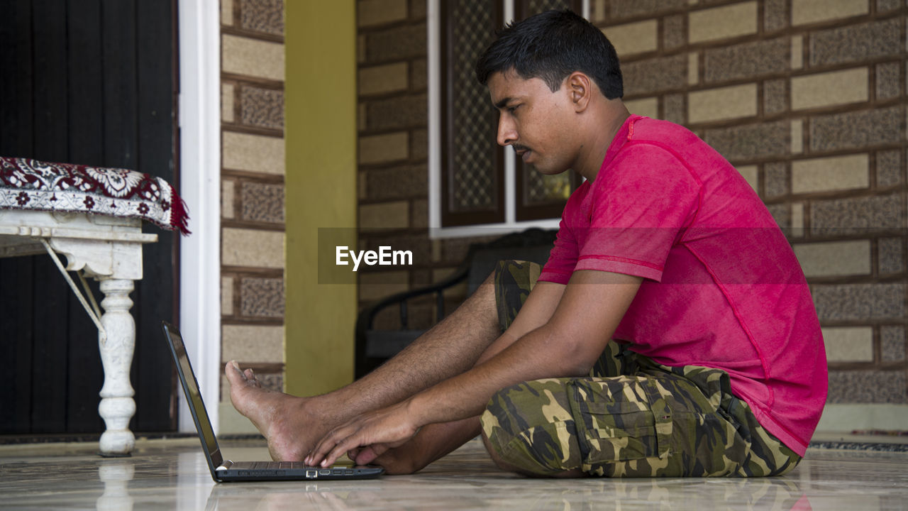 Indian teacher using computer remote studying, virtual training, watching online education at home 