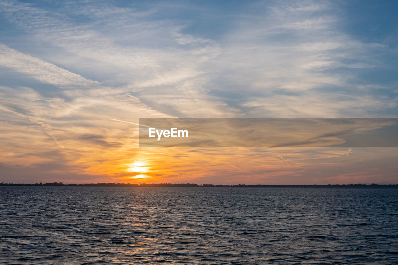 SCENIC VIEW OF SEA DURING SUNSET