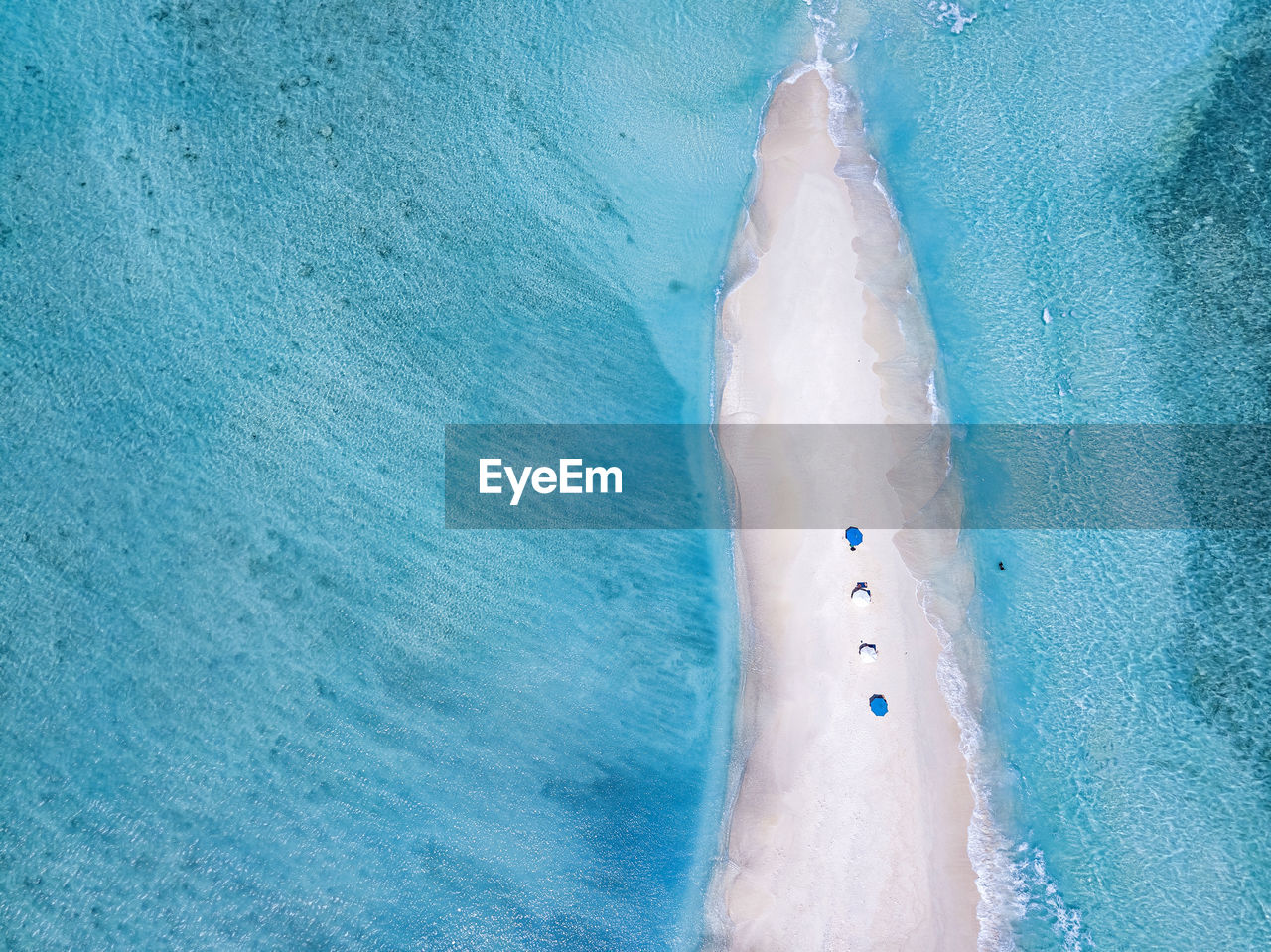 Maldives, aerial view of small sandy islet off coast of indian ocean in summer