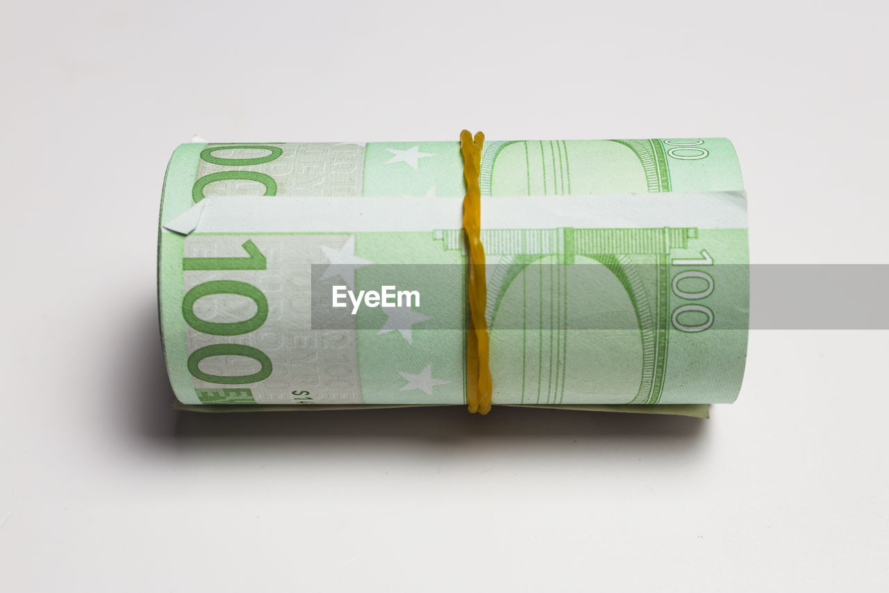 currency, finance, paper currency, business, studio shot, wealth, white background, green, indoors, savings, no people, cut out, finance and economy, investment, close-up