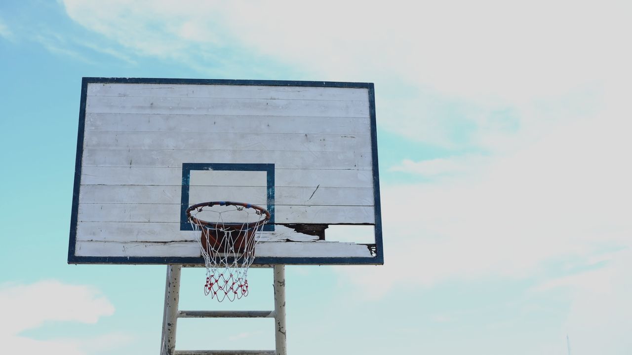 Low angle view of basketball hoop against sky