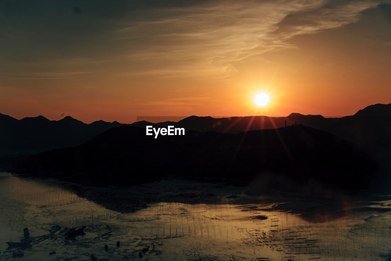 Scenic view of mountains against sky during sunset