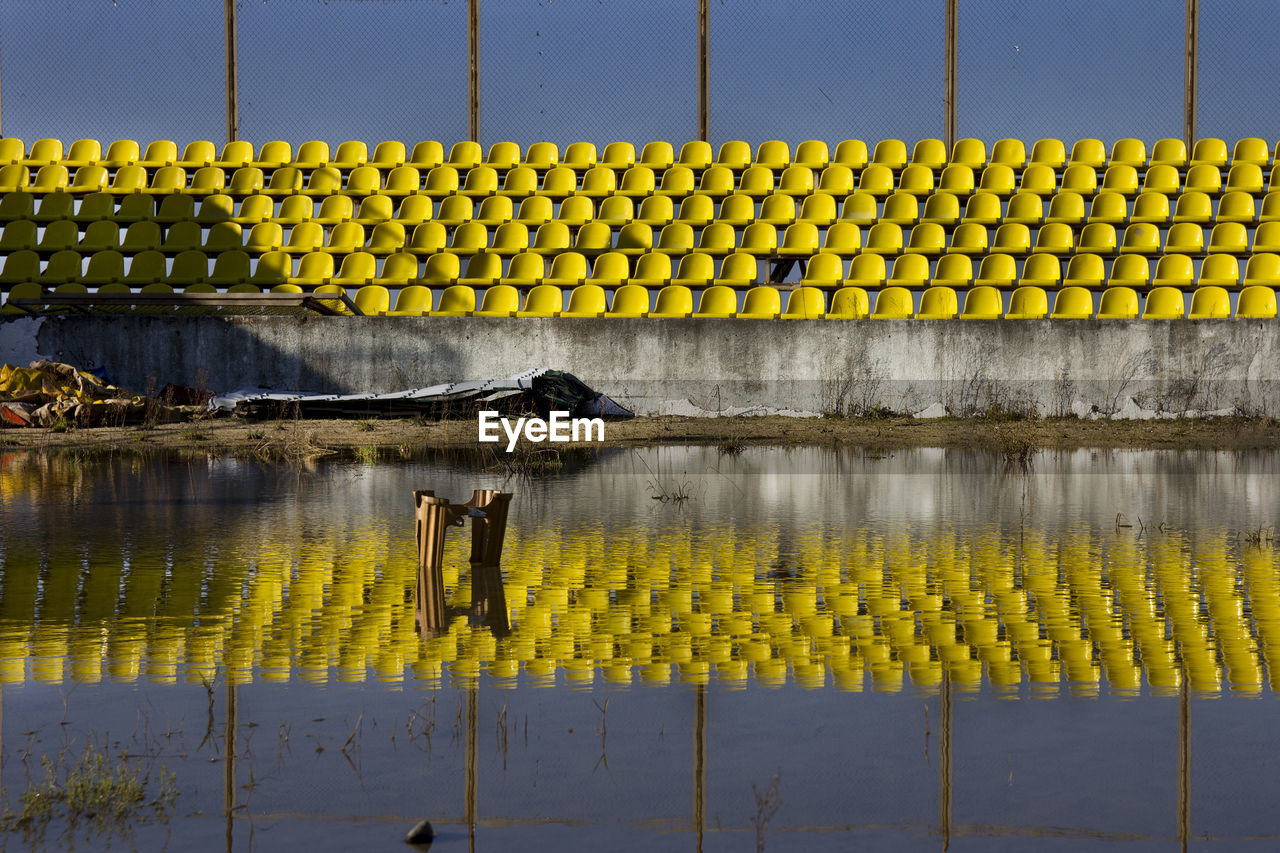 Reflections of seats in water