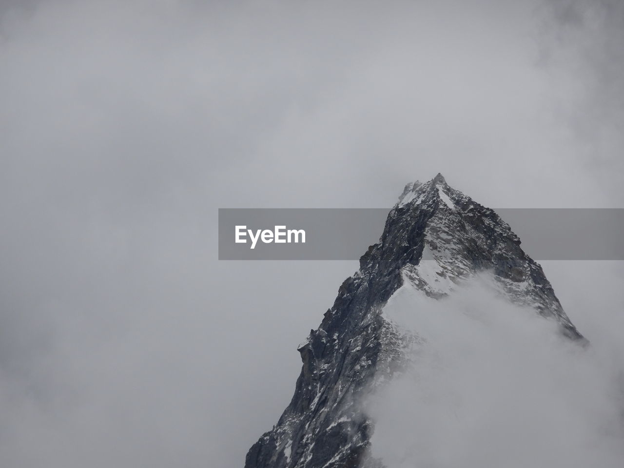 Low angle view of snowcapped mountain against sky ama dablam