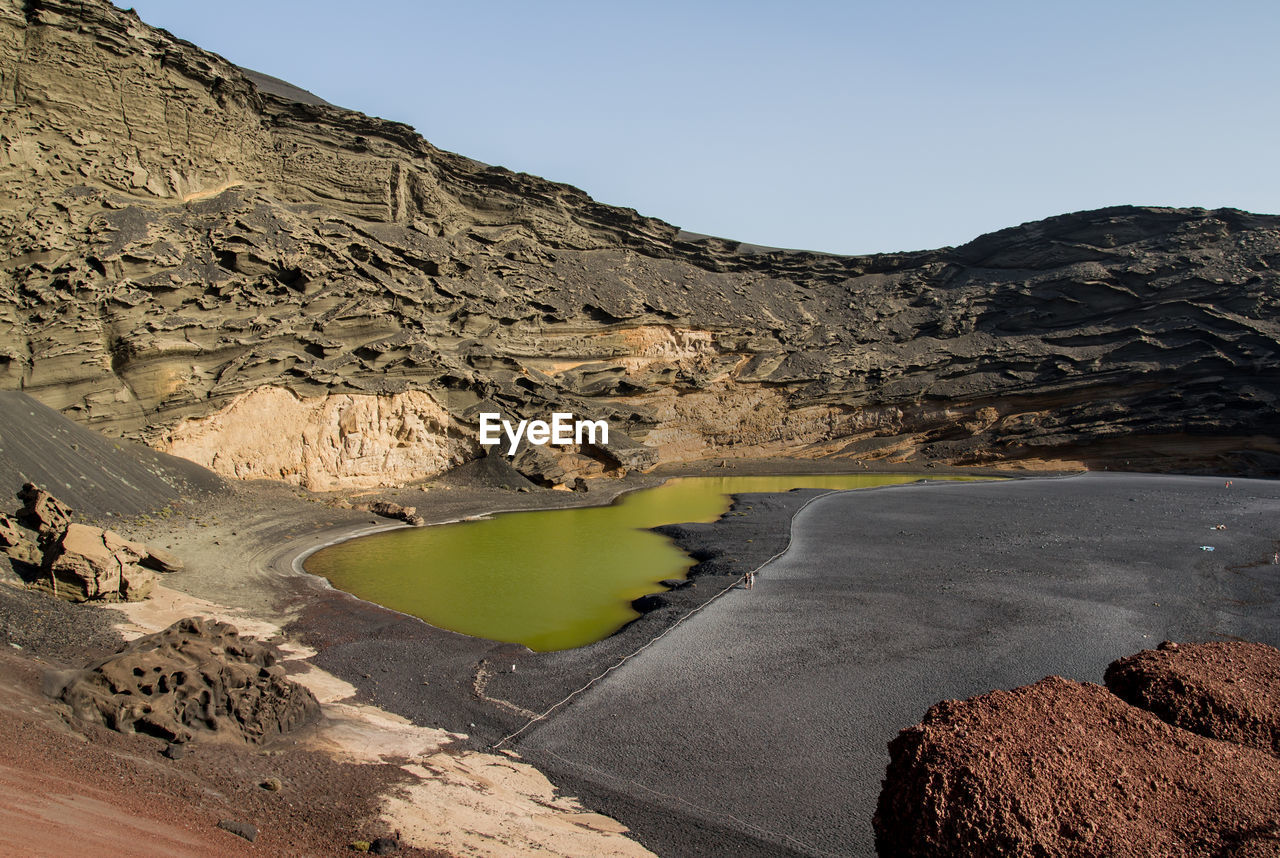 Scenic view of green lagoon at el golfo against sky