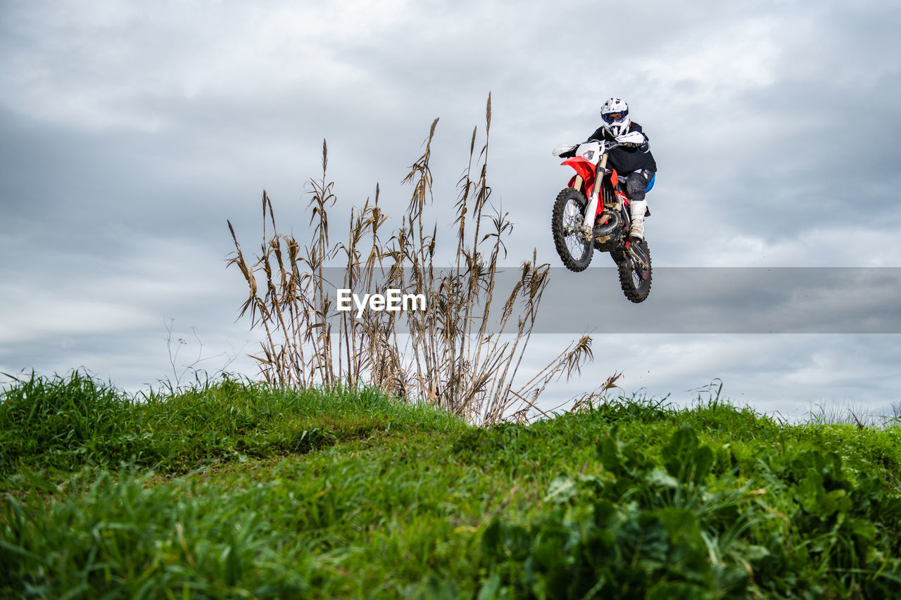 low angle view of bicycle on field against sky