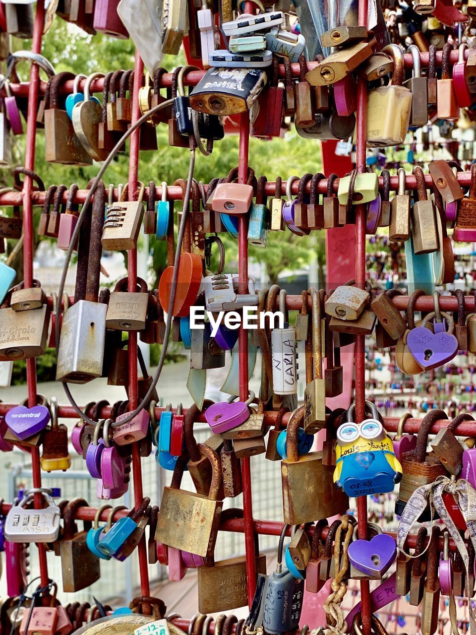 Padlocks hanging on railing