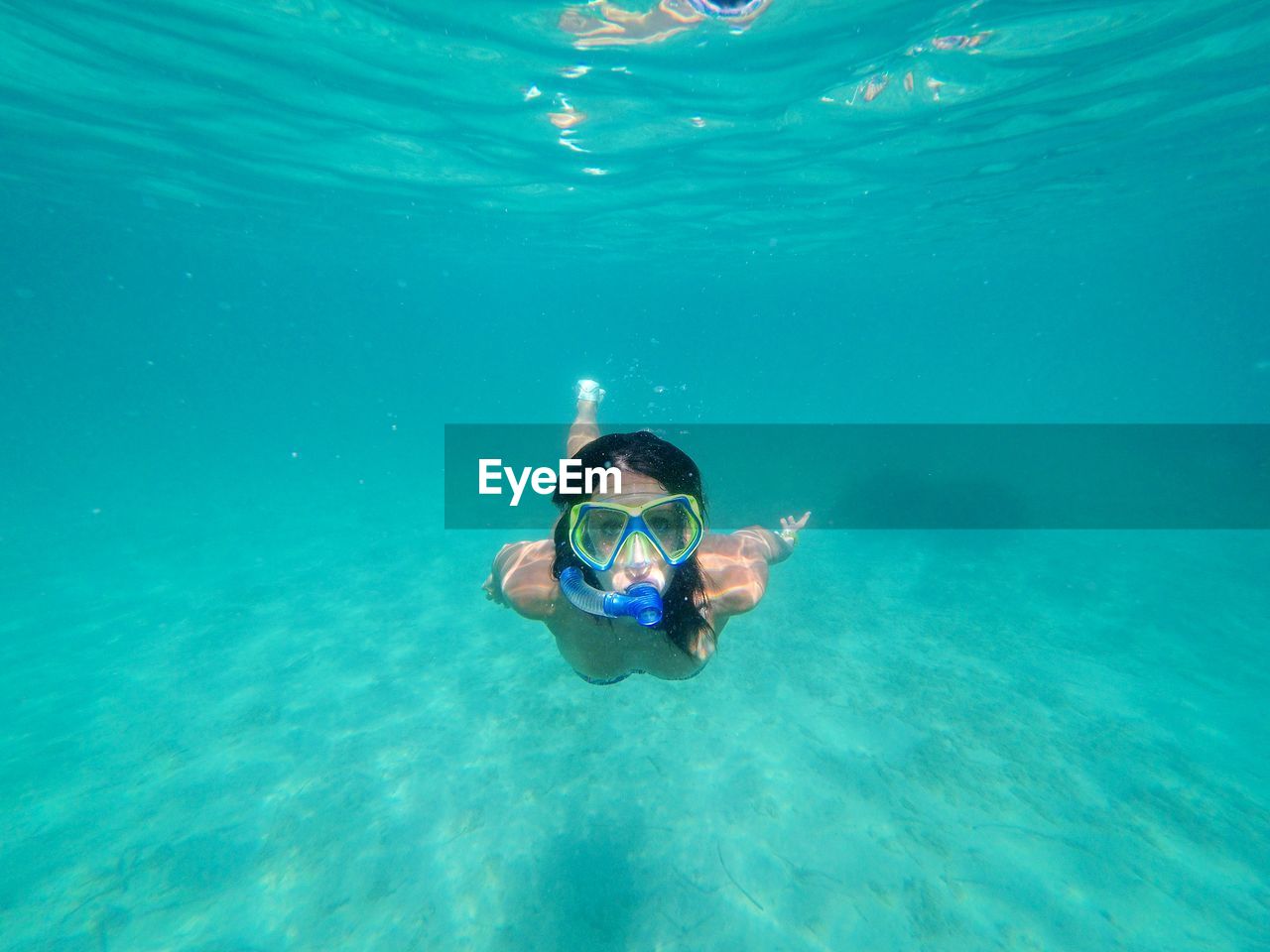 Portrait of woman swimming in sea