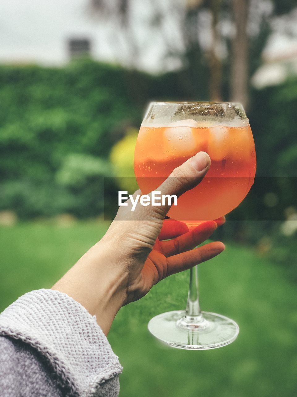 Close-up of hand holding drink 