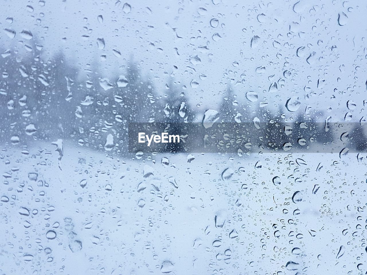 CLOSE-UP OF RAINDROPS ON WINDOW