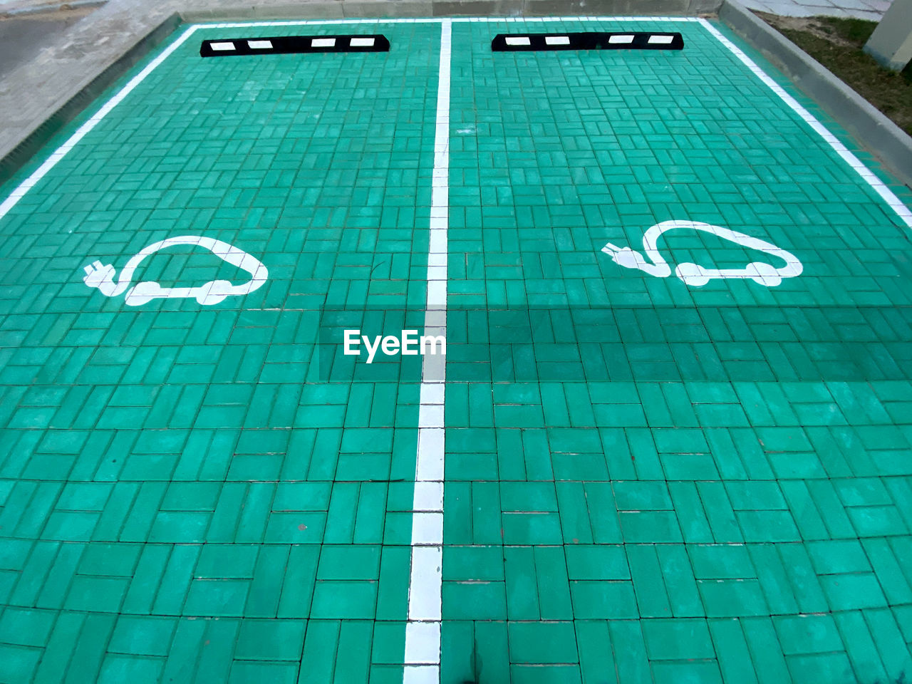 HIGH ANGLE VIEW OF SWIMMING POOL WITH GREEN LIGHTS