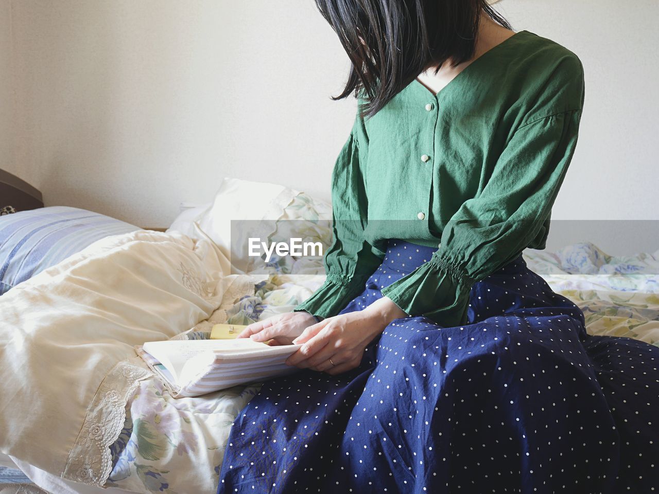 Reading a book on the bed