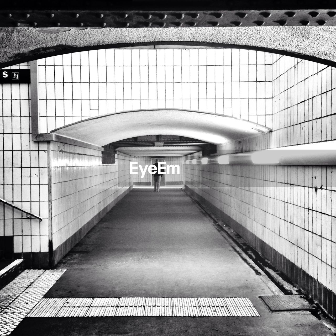 Man waking in tunnel