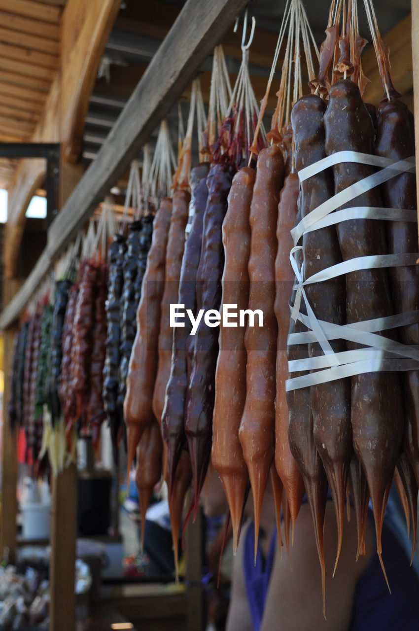 GROUP OF PEOPLE AT MARKET STALL