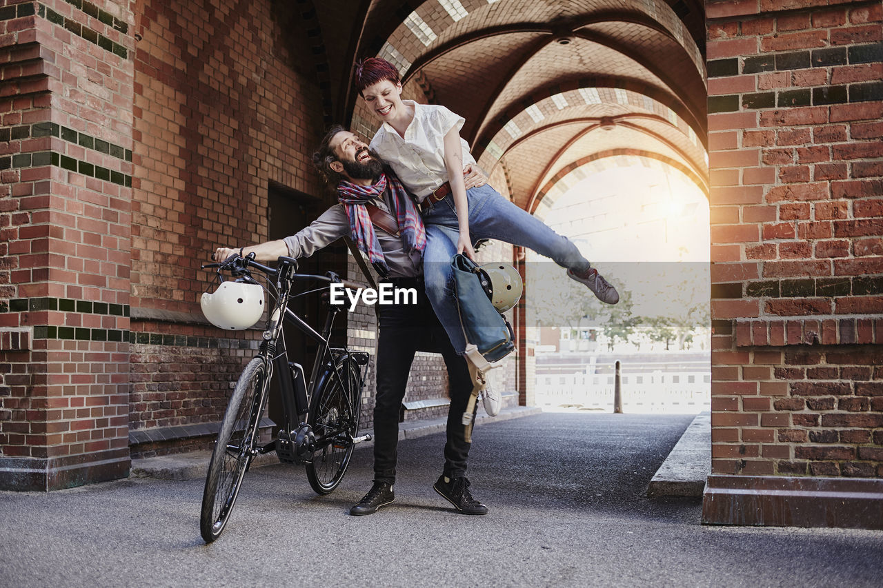 Happy couple with electric bicycle