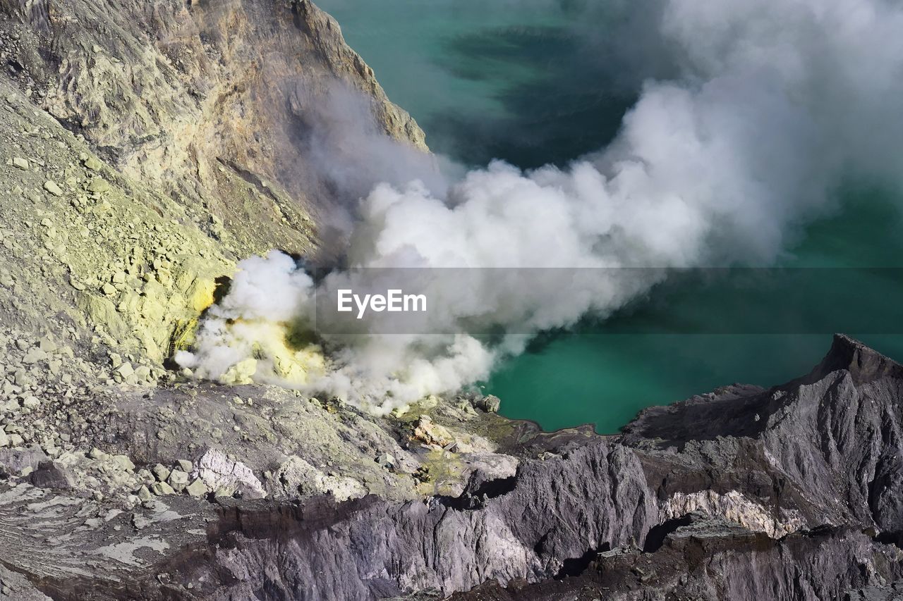 High angle view of mountains amidst smoke