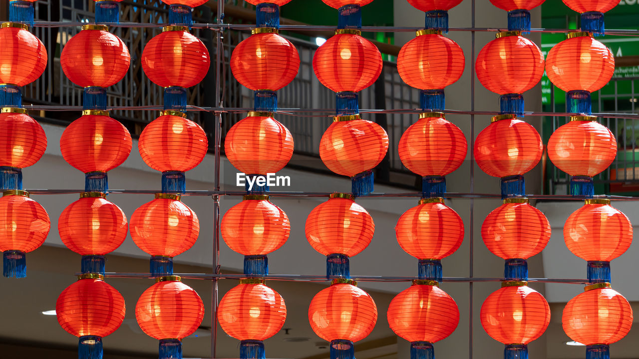 Low angle view of illuminated lanterns hanging at night