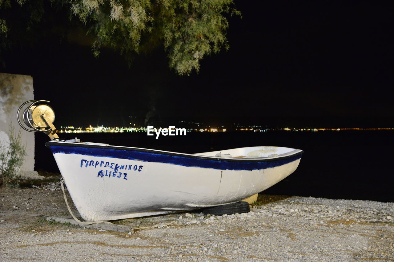 MOORED BOATS AT NIGHT