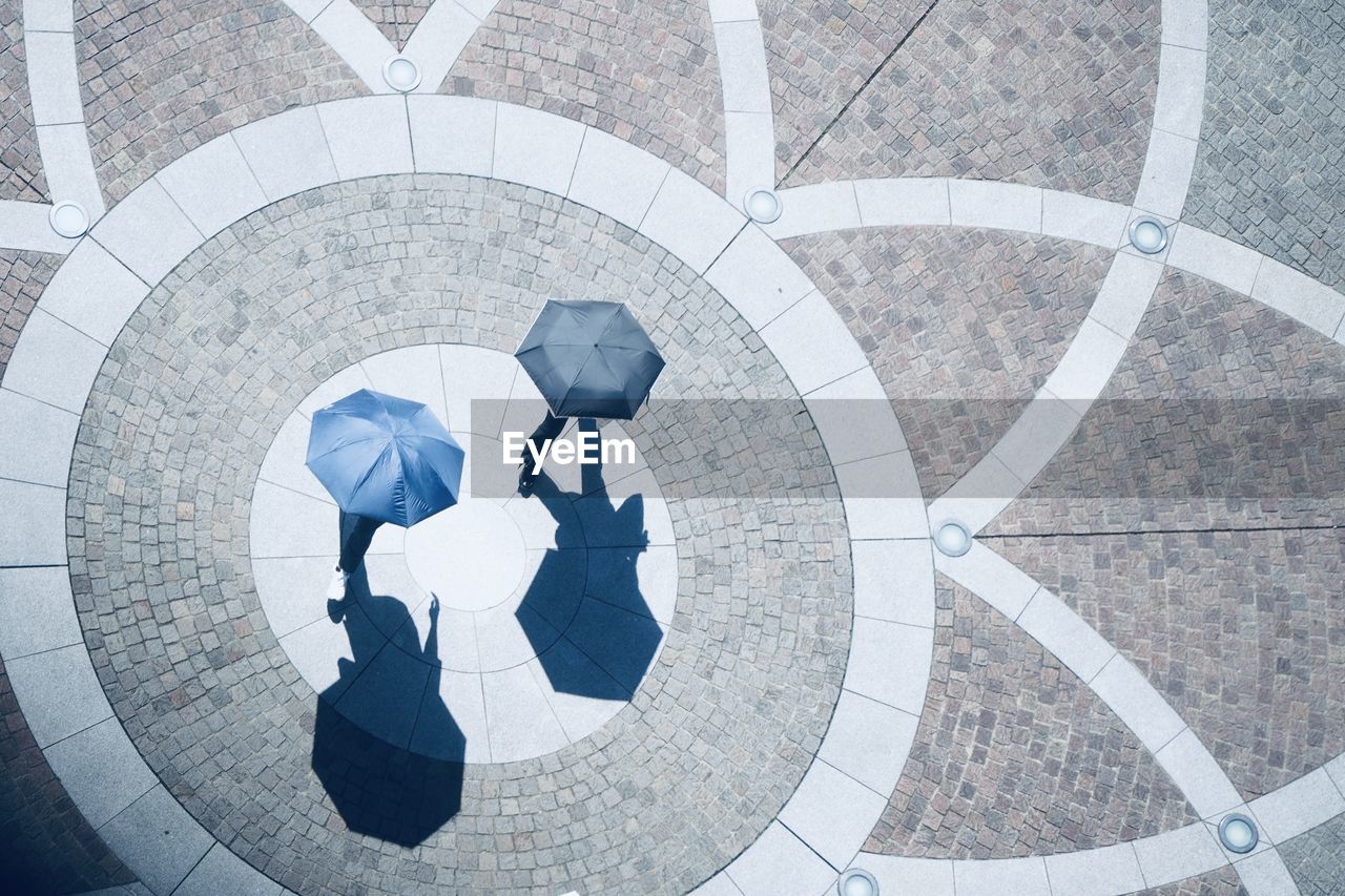 circle, shape, geometric shape, high angle view, pattern, men, adult, blue, art, communication, city, business, flooring, architecture, day, map