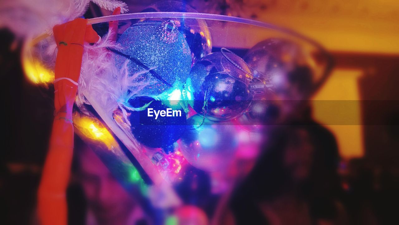 Close-up of christmas baubles in glass