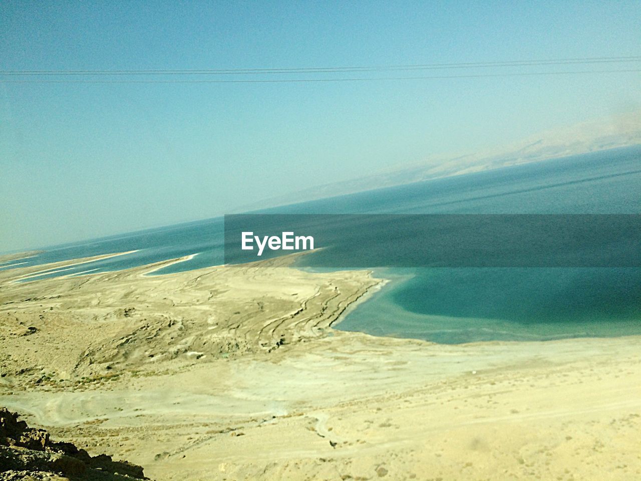 SCENIC VIEW OF BEACH AGAINST CLEAR SKY