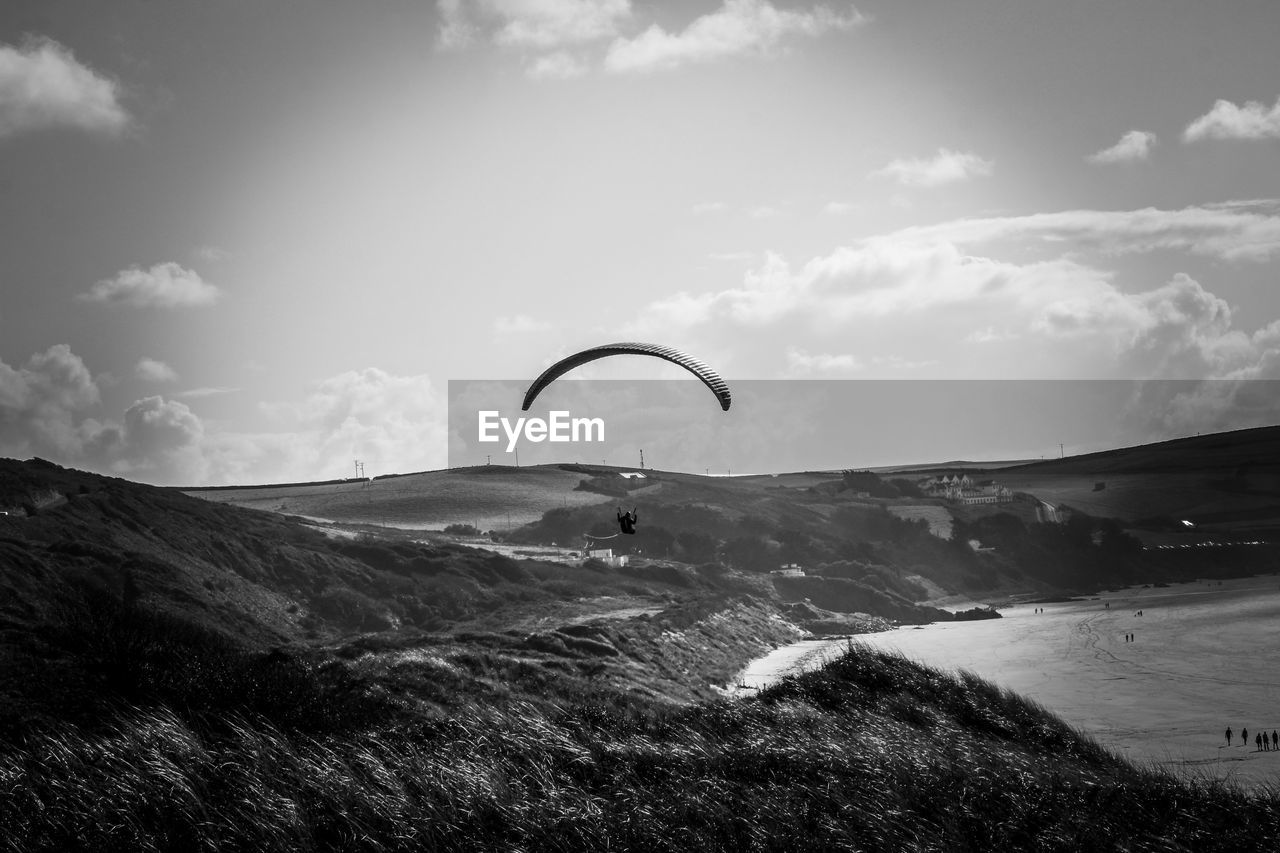 Scenic view of mountain against sky paragliding 