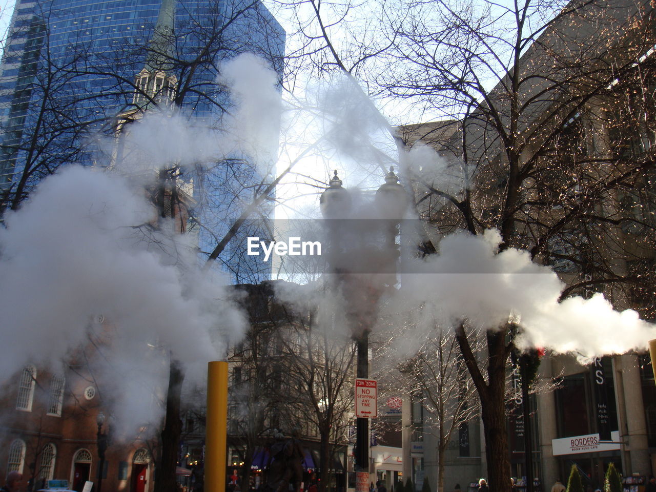 BUILDINGS IN CITY AGAINST CLOUDY SKY