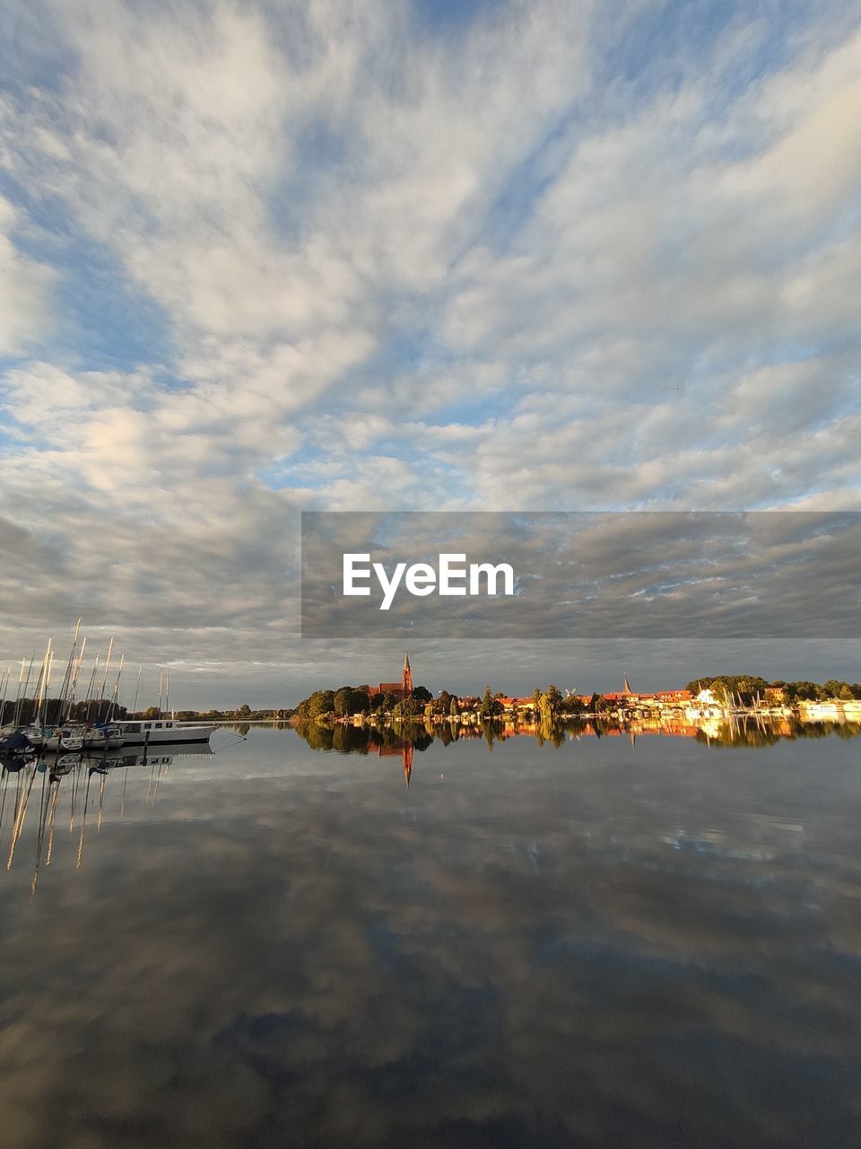 REFLECTION OF BUILDING IN SEA