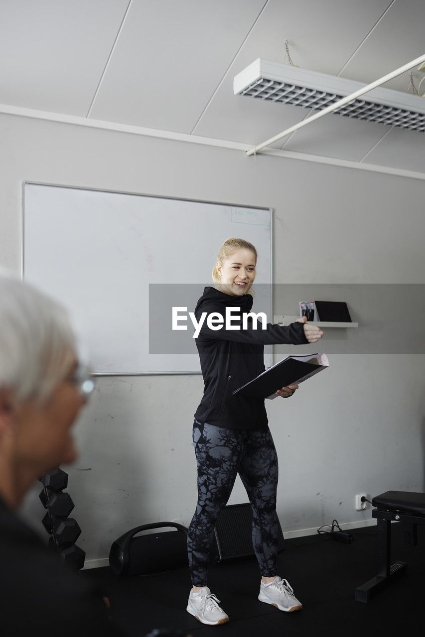 Female coach during presentation in gym