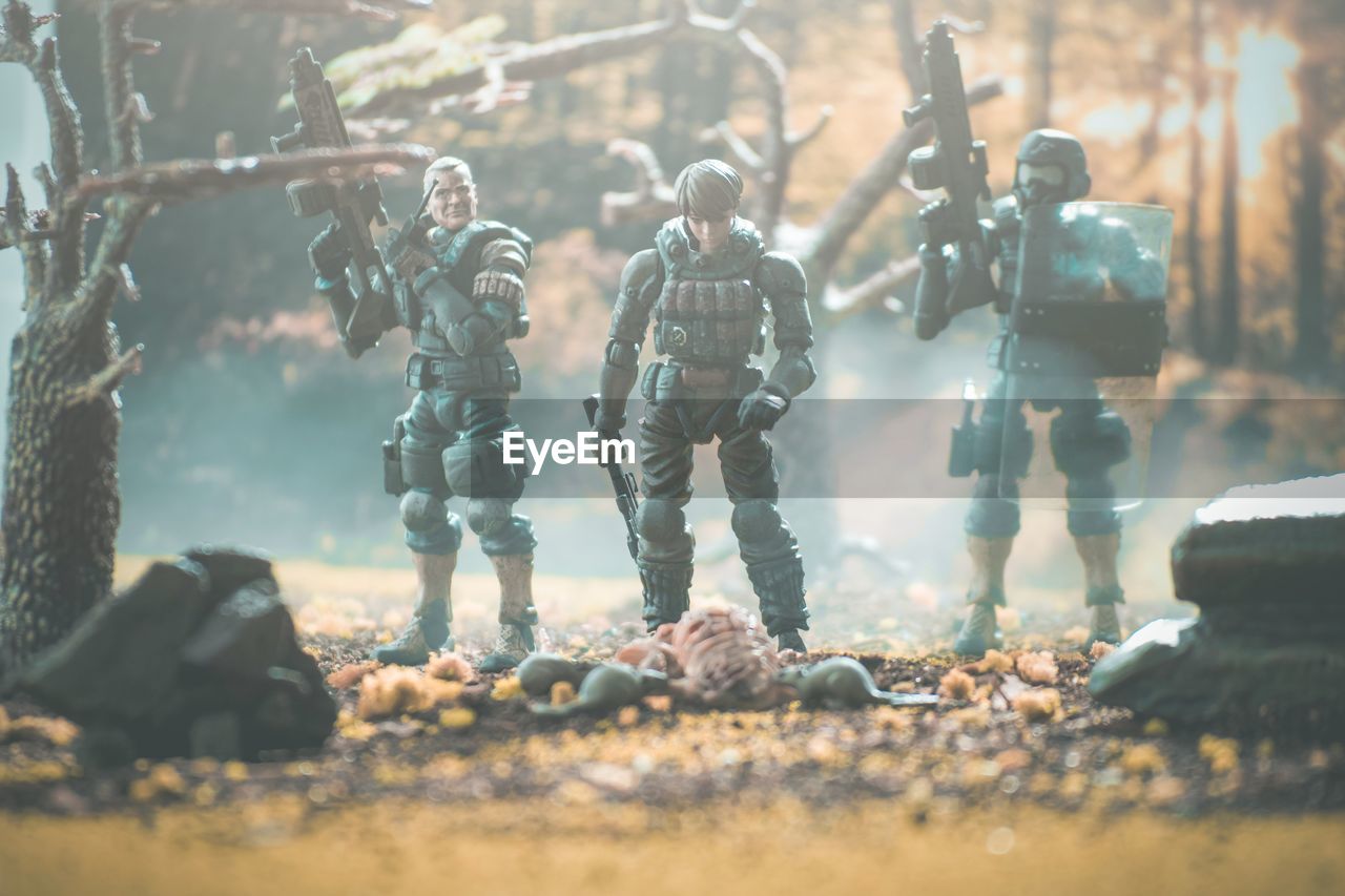 armed forces, government, military, group of people, adult, violence, fighting, weapon, conflict, men, security, protection, screenshot, war, soldier, teamwork, gun, cooperation, uniform, military uniform, nature, sports, army, clothing, person, rifle, selective focus, aggression, outdoors, headwear, battle
