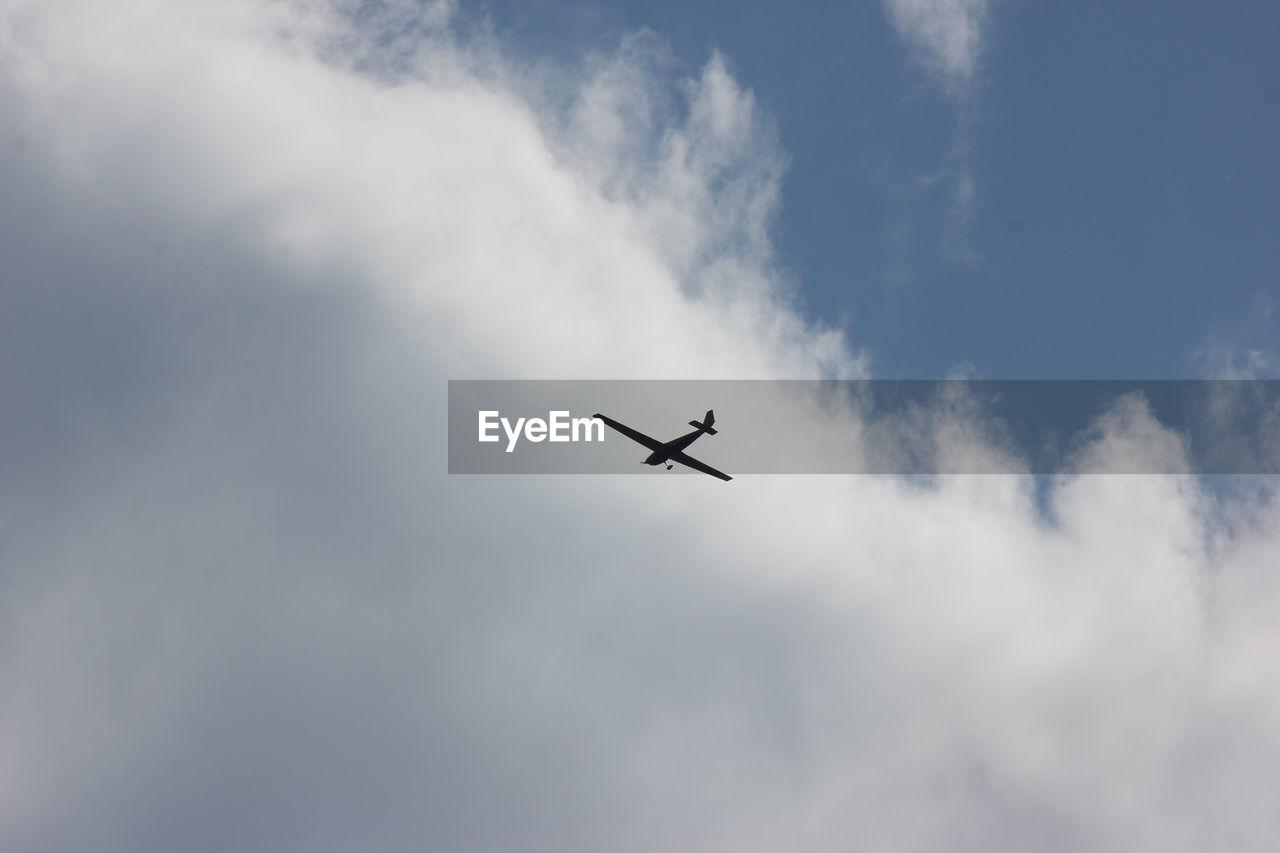 Low angle view of airplane in sky