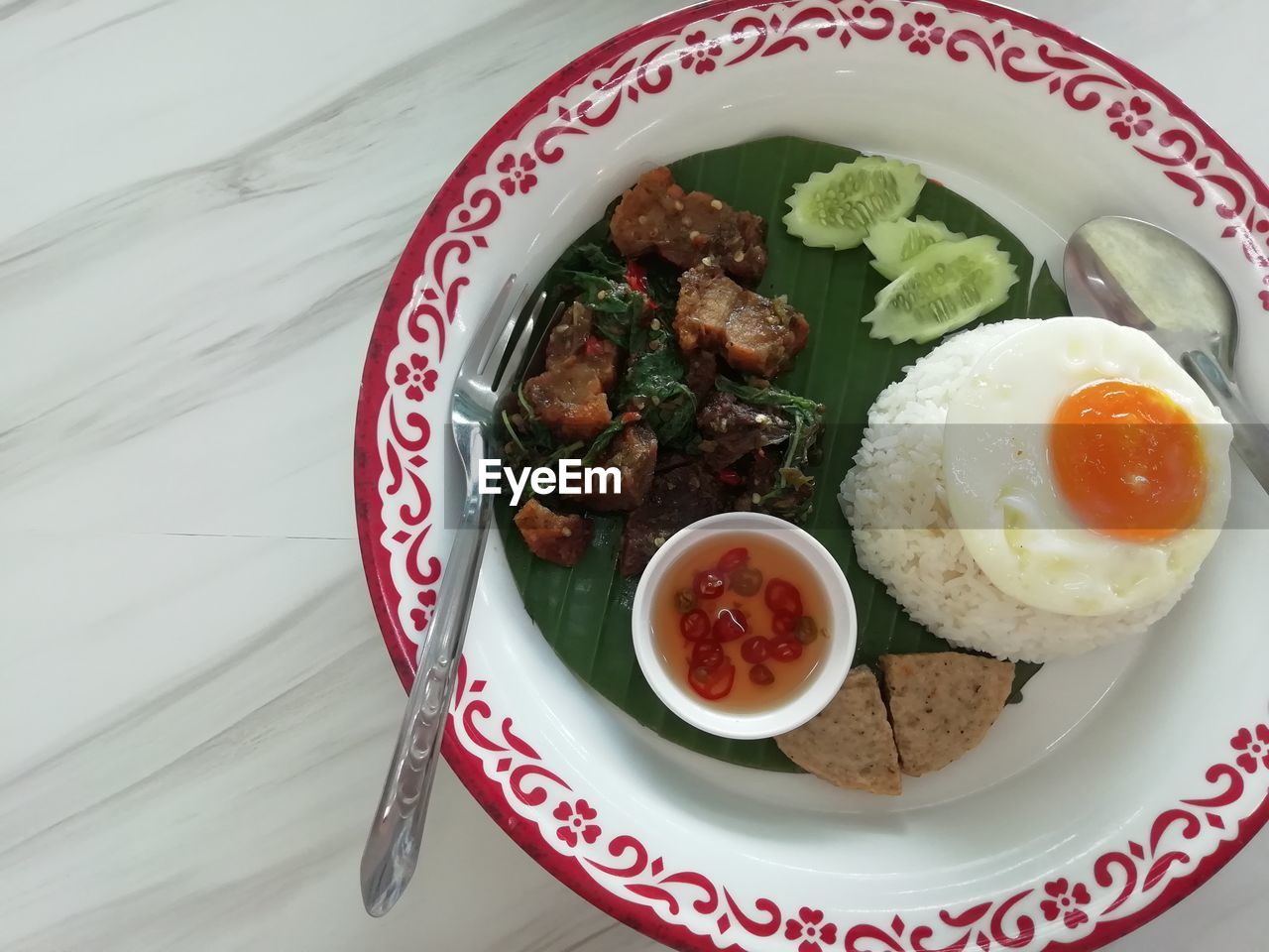 Thai crispy pork basil with fried eggs