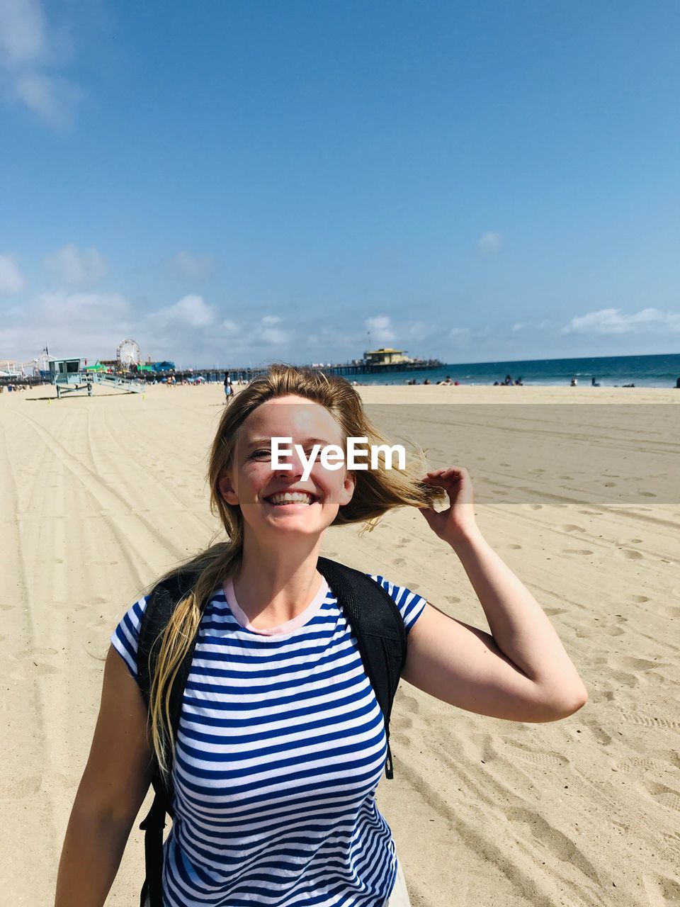 Portrait of smiling young woman on beach