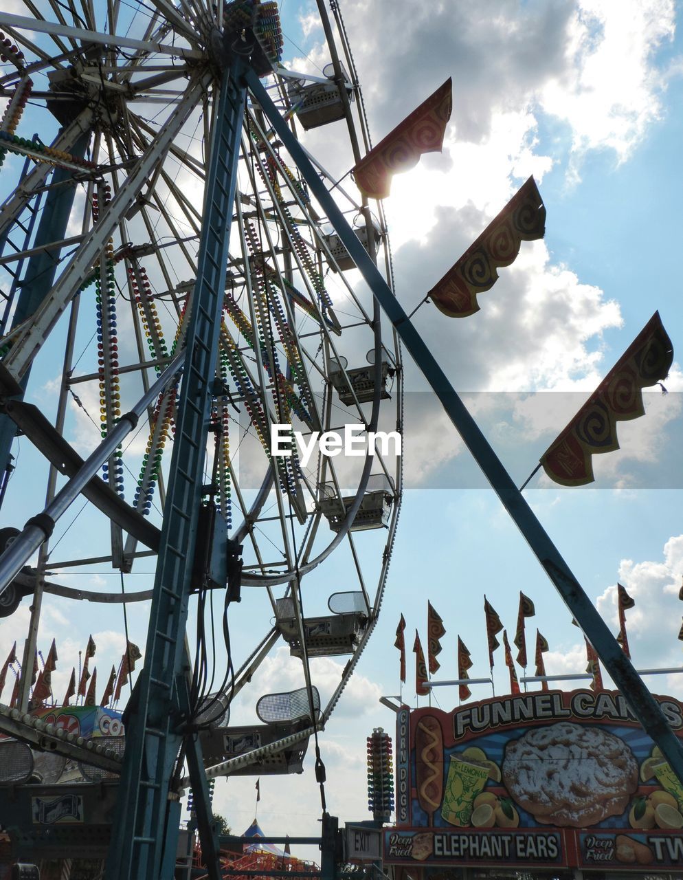 LOW ANGLE VIEW OF FERRIS WHEEL AGAINST SKY