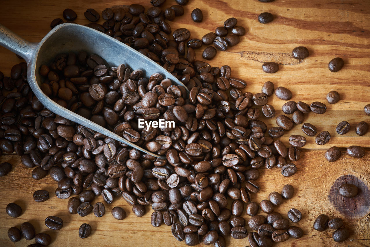 Close-up of roasted coffee beans on table