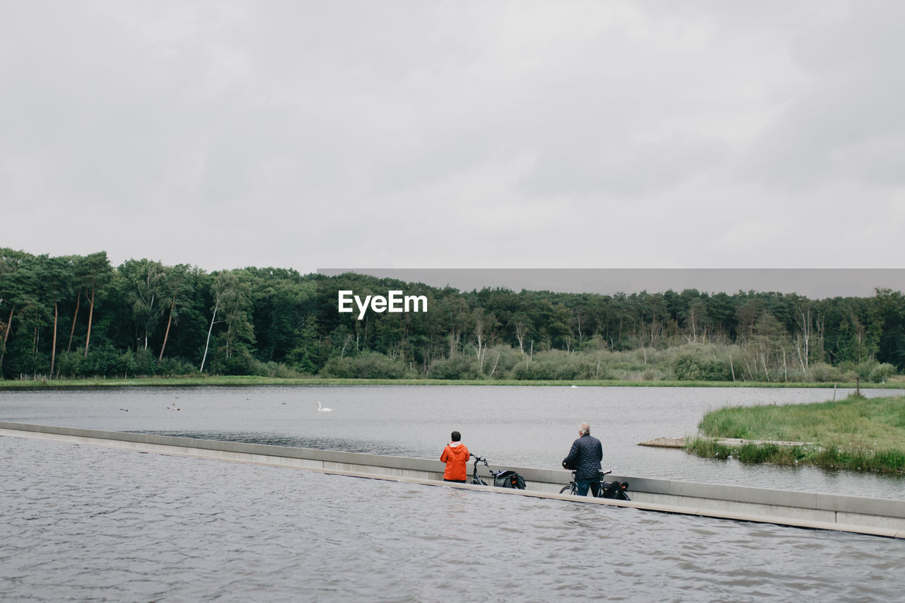 MAN RIDING HORSE IN RIVER