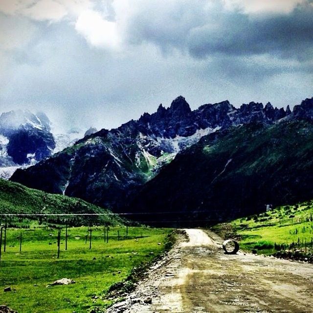 ROAD PASSING THROUGH LANDSCAPE