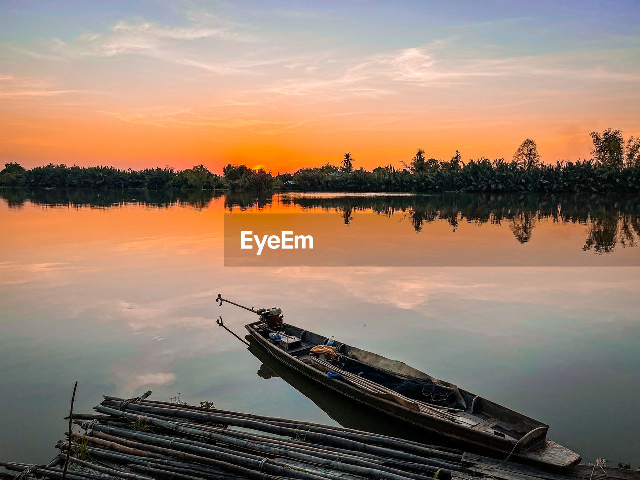 Scenic view of lake against sky during sunset