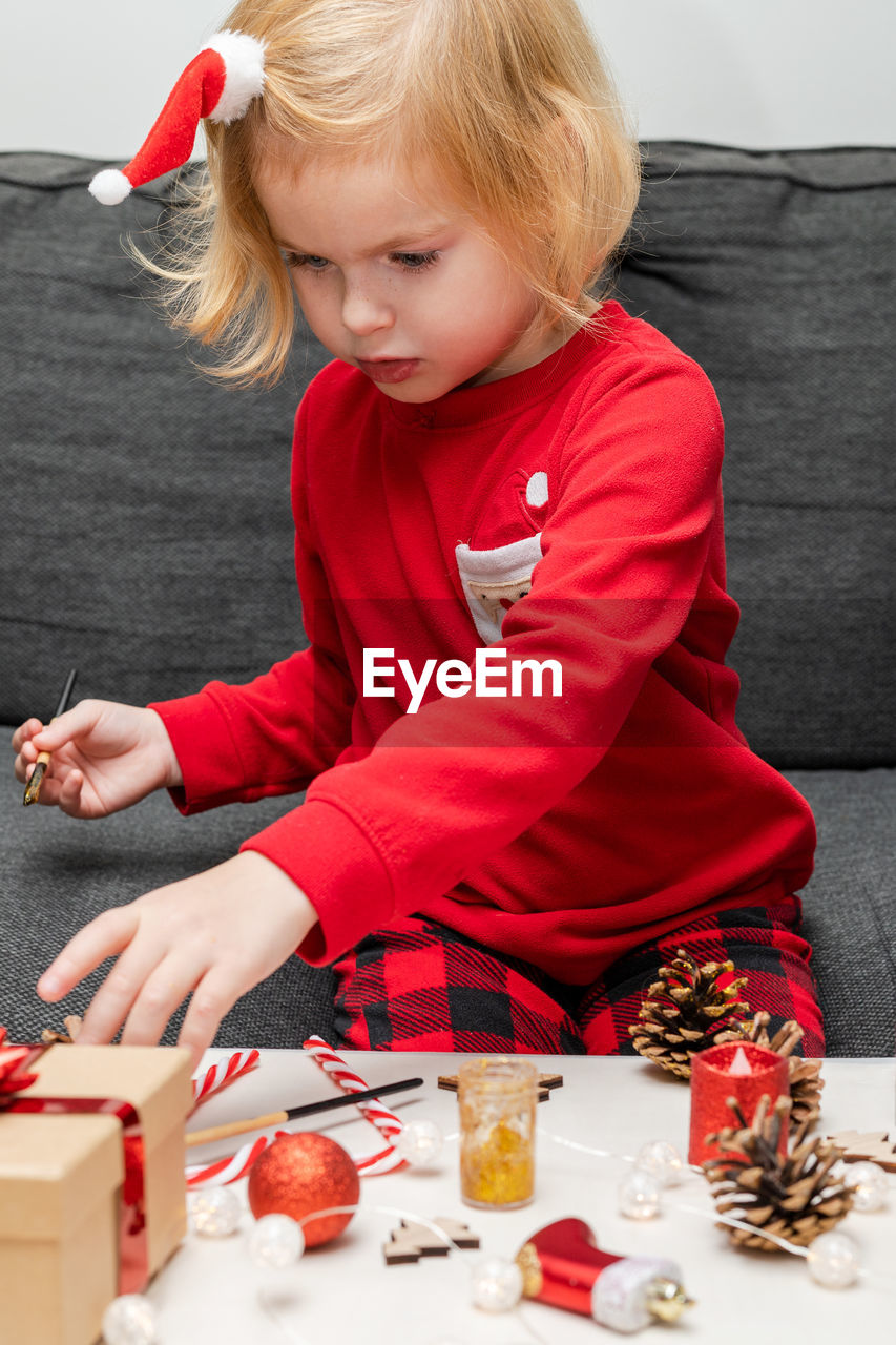 portrait of boy playing with toy blocks on table