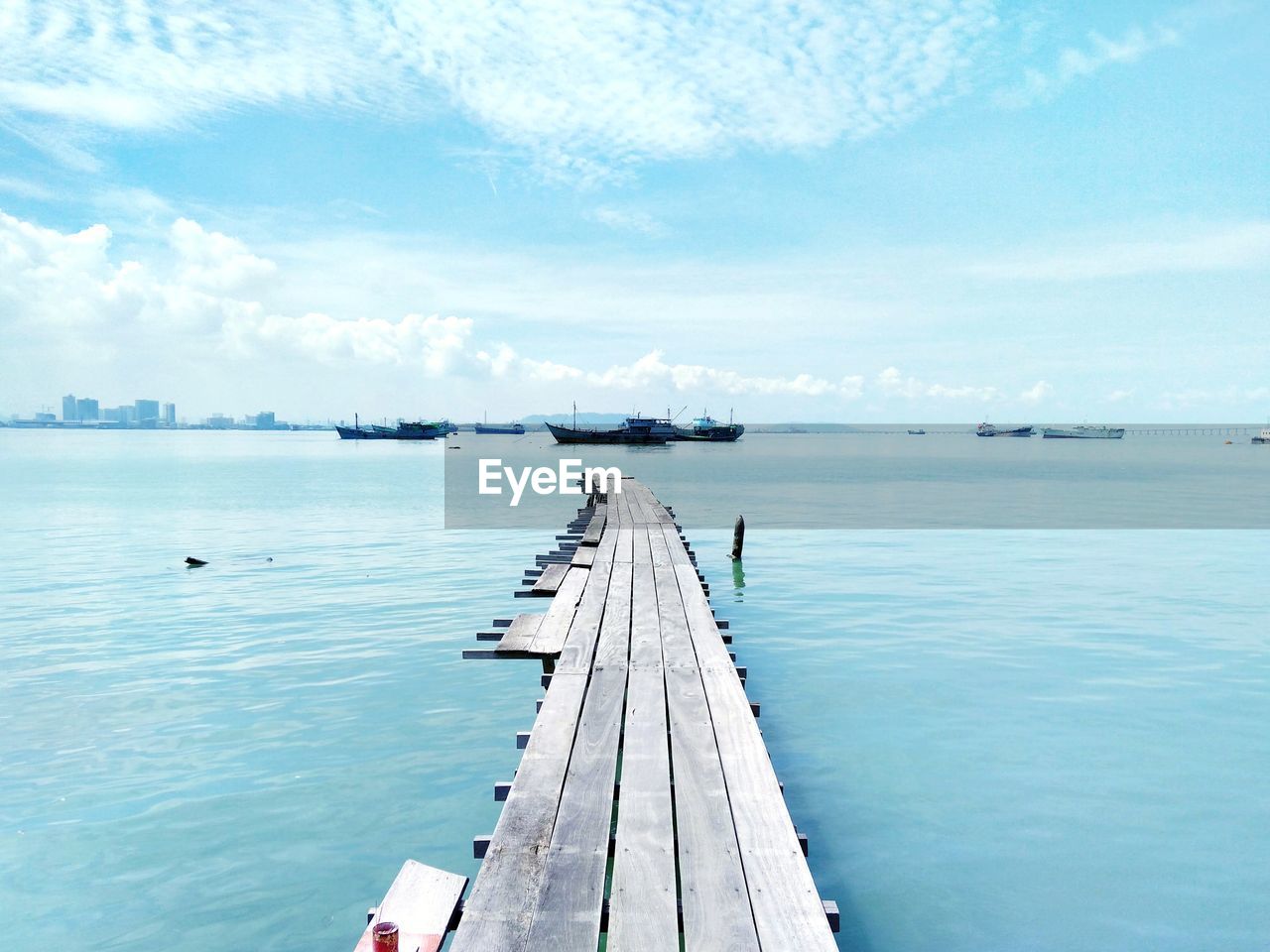 Pier over sea against sky