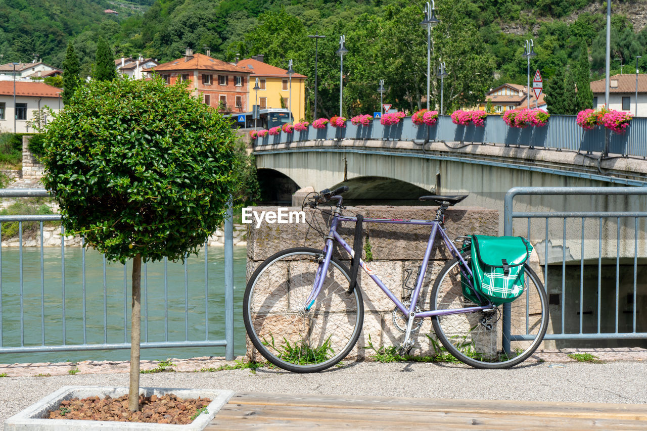 BICYCLE BY CANAL AGAINST BUILDING