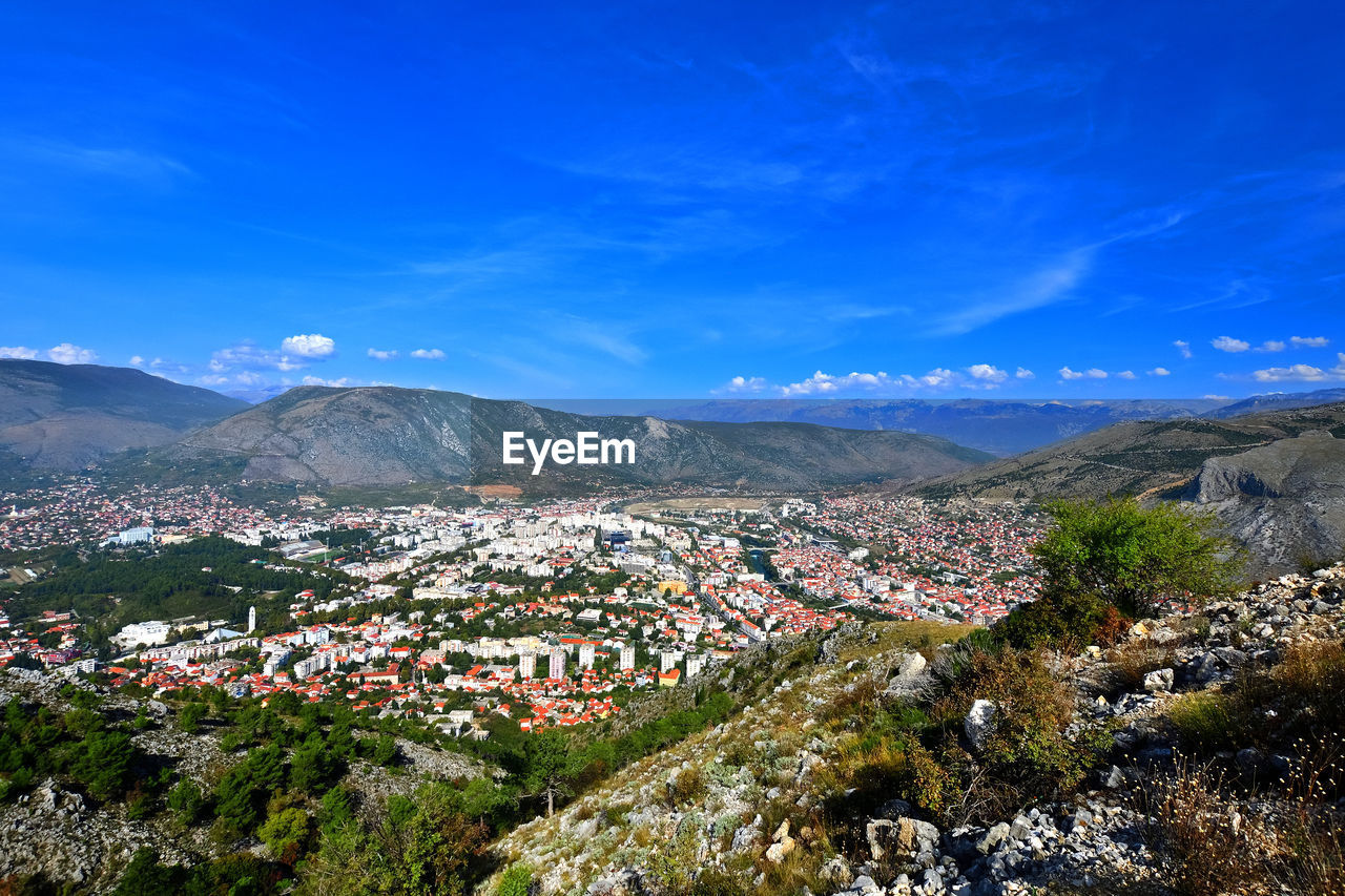 Aerial view of townscape against sky