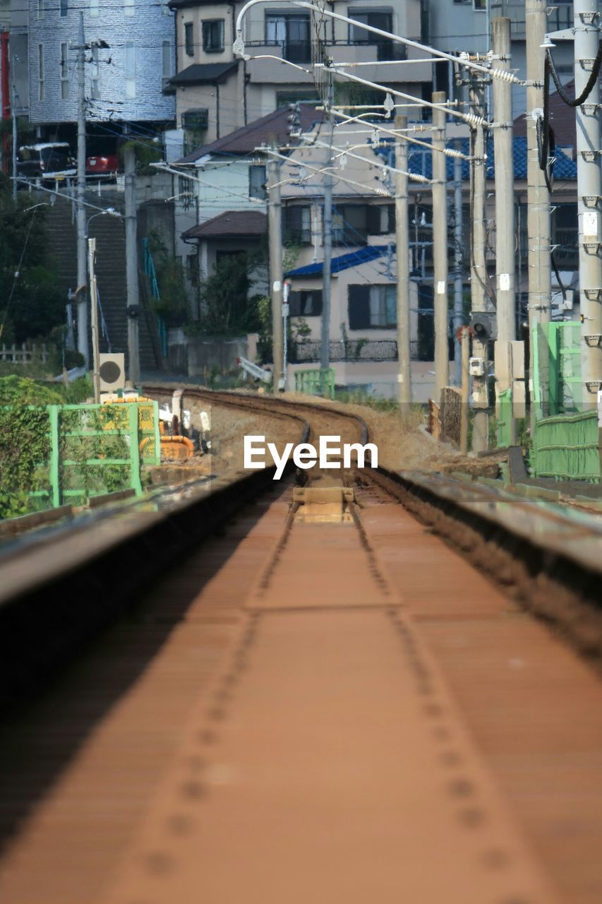 Tilt shift of railroad track against building