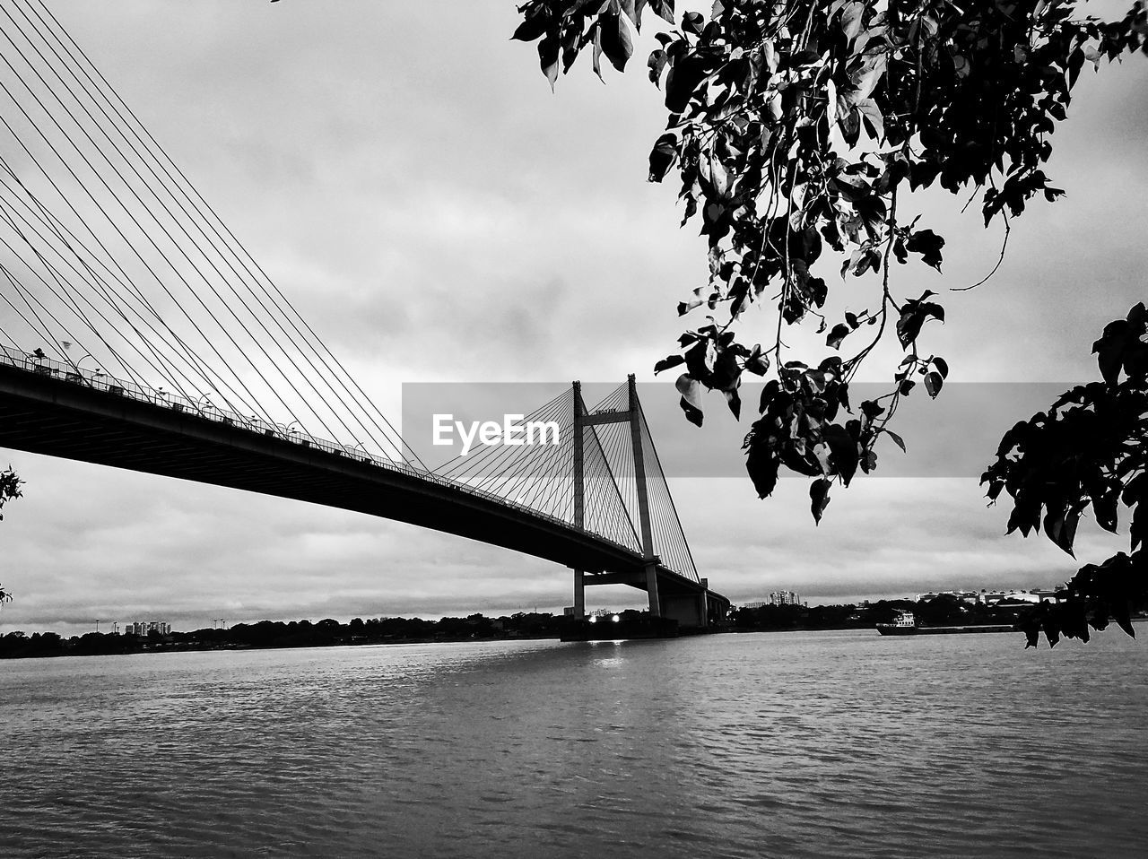 bridge, water, architecture, built structure, sky, suspension bridge, transportation, black and white, nature, travel destinations, cloud, engineering, monochrome photography, monochrome, city, travel, river, tourism, beauty in nature, bay, bay of water, cable-stayed bridge, scenics - nature, outdoors, landscape, tree, plant, building exterior, environment, tranquility, tranquil scene, cityscape, reflection, dramatic sky, day, silhouette