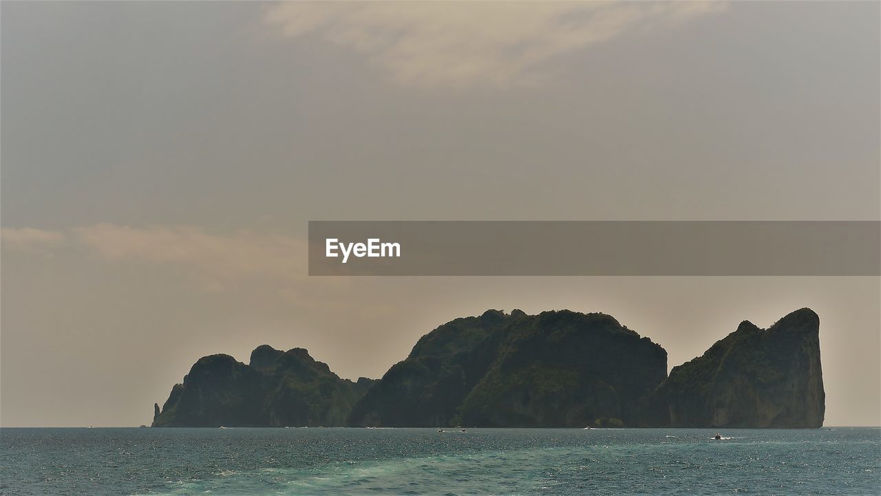 Scenic view of sea against sky at sunset