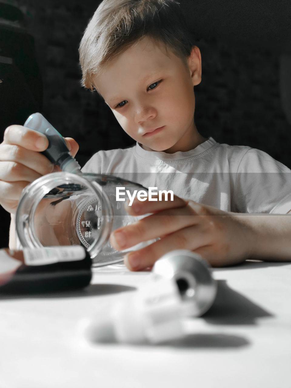 Portrait of boy holding table