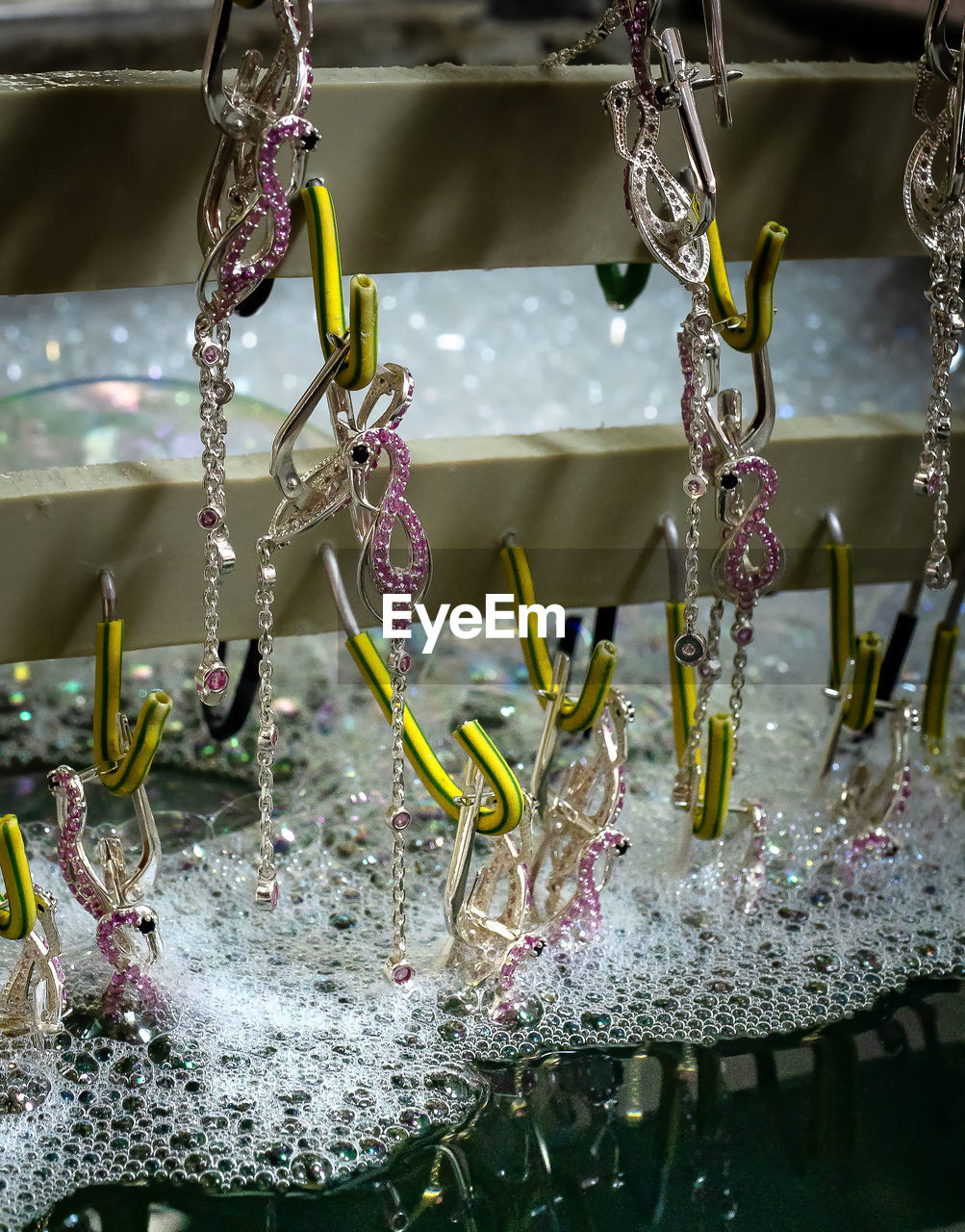 CLOSE-UP OF WATER DROPS HANGING ON METAL FOR SALE AT MARKET