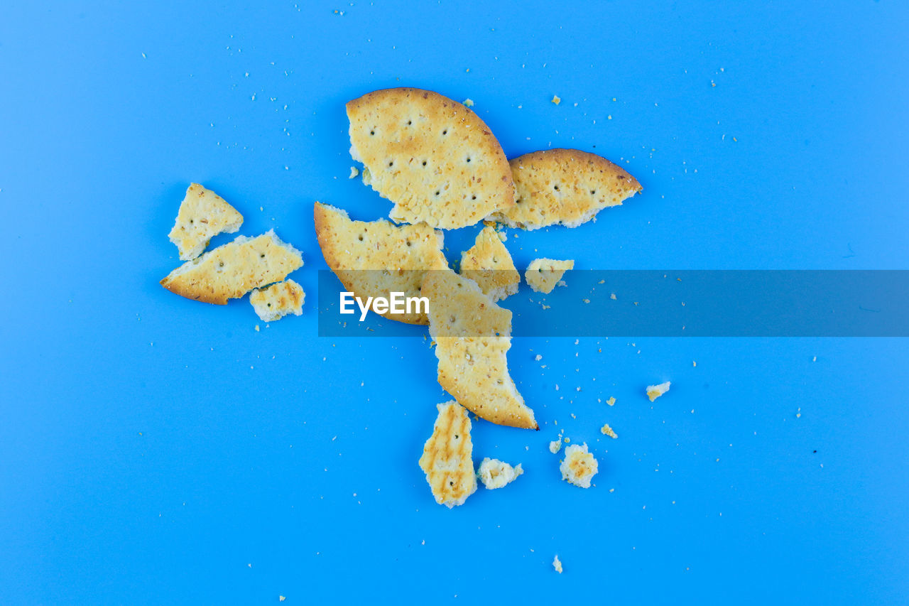 HIGH ANGLE VIEW OF BREAD IN BLUE BACKGROUND