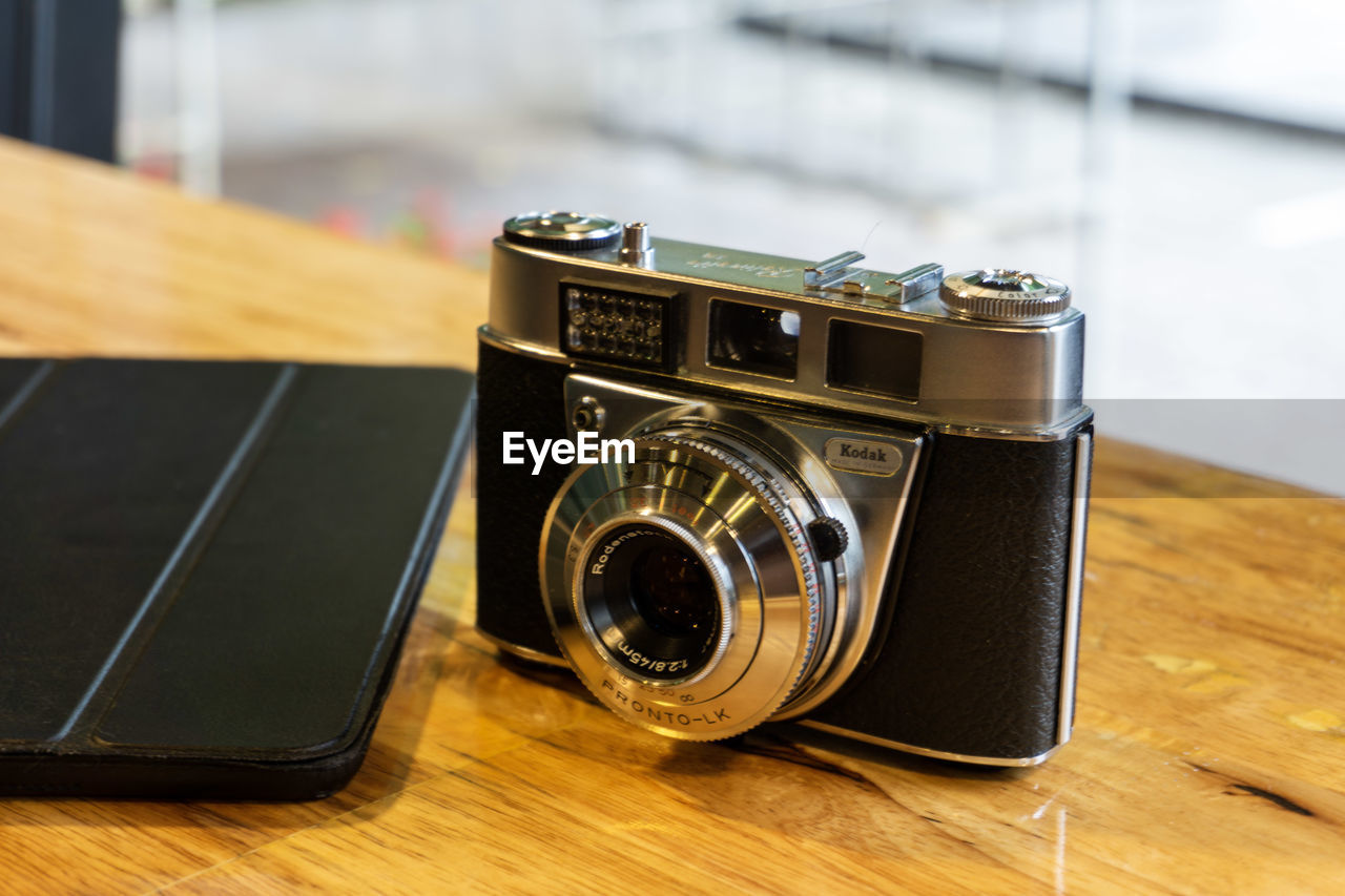 Close-up of camera on table