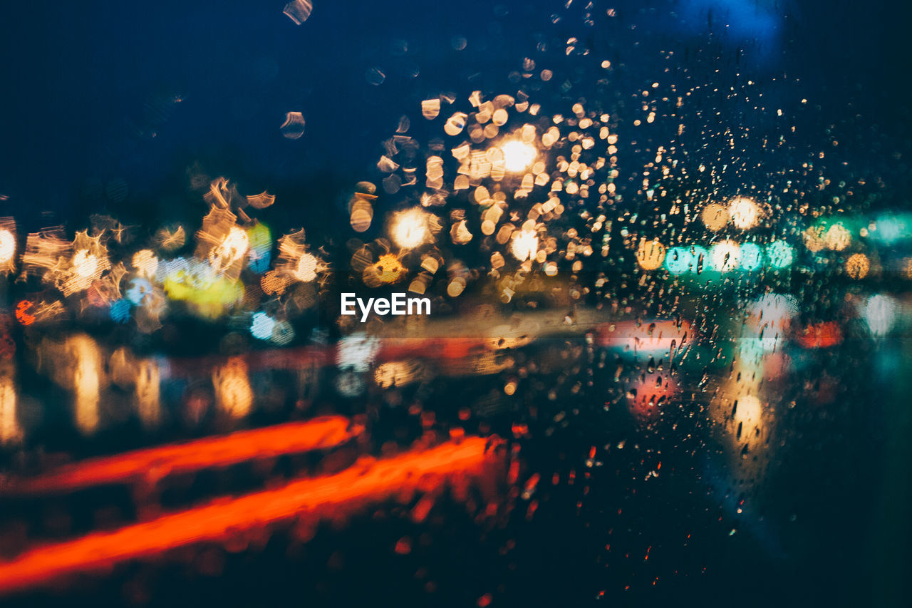 Full frame shot of wet glass window in rainy season